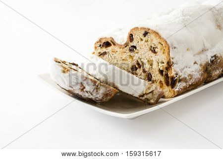 Christmas stollen. Traditional German Christmas dessert. isolated on white background