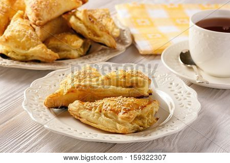 Puff pastry triangles filled with feta cheese and leek.
