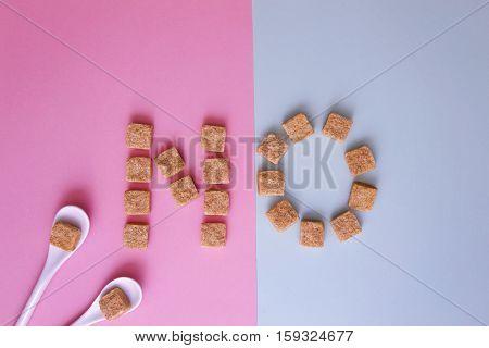 Sugar cubes arranged as word NO on white background. Top view. Diet unhealty sweet addiction concept