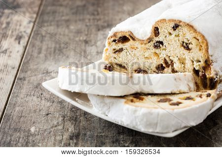 Christmas stollen. Traditional German Christmas dessert on wooden background
