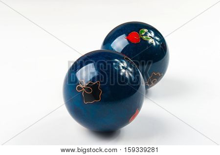 pair of blue Chinese singing balls Baoding of health for hands on white background