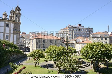 PONTEVEDRA, SPAIN - AUGUST 6, 2016: Church of the Pilgrim Mother adn other buildings in plaza in the city of Pontevedra Galicia Spain.