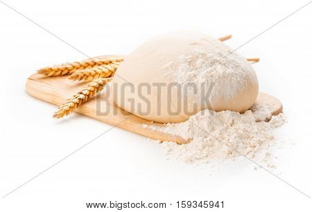 Dough with ears of wheat isolated on white background