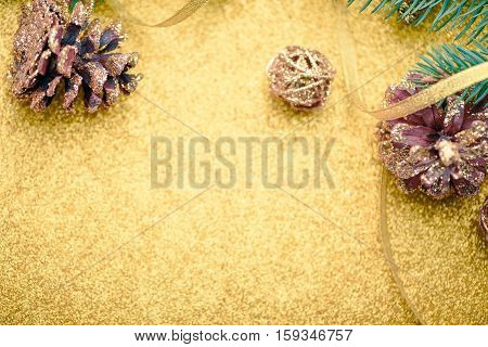 Merry Christmas background. New year. Tree, gold, cones, ornaments