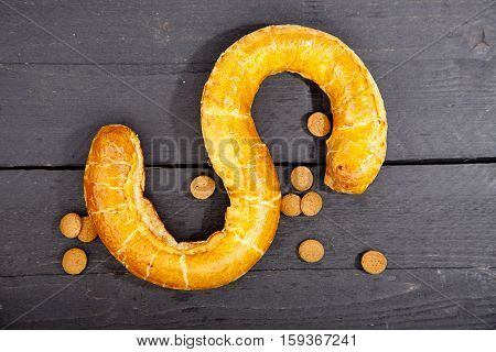 Traditional Dutch cookie Banketletter at Sinterklaas celebration on wooden background