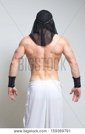 Arabic man posing. sexy bodybuilder on a white background