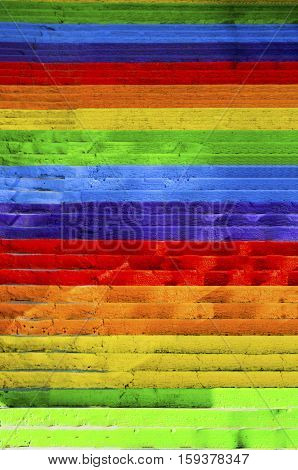 Concrete stairs painted in rainbow colors. Background