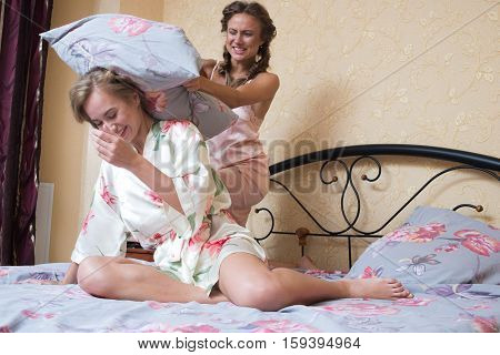Two sexy young women in bed. beautiful gentle girlfriend