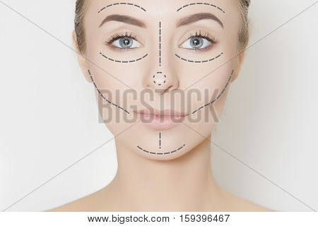 Closeup of female adult with marks on skin for cosmetic medical procedures