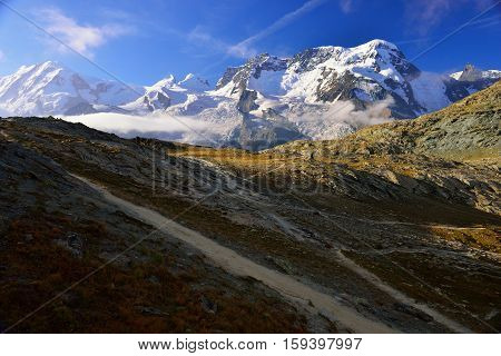 The hiker are walking from Rotenboden station to Riffelsee lake and Matterhorn in summer Zermatt Switzerland