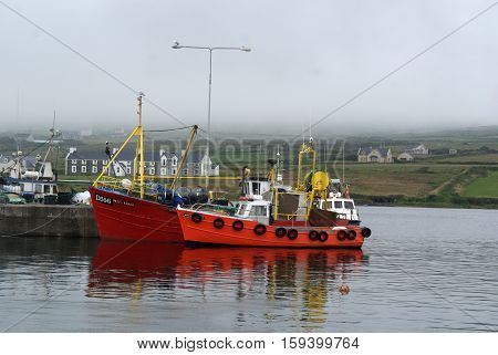 Fishing boat in dock in Portmagee, Ireland