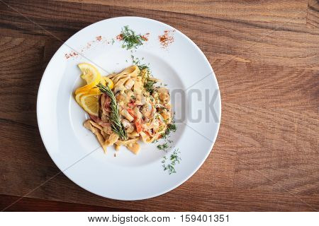 Pasta With Seafood On Weathered Wooden Background.