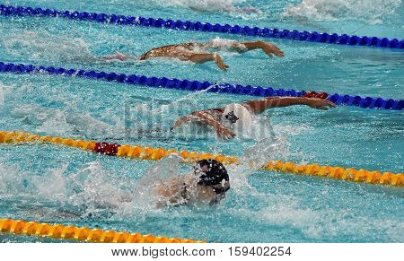 Hong Kong China - Oct 29 2016. SAVARD Katerine (CAN) Katinka HOSSZU (HUN) and WORRELL Kelsi (USA) swimming in the Women's Butterfly 100m Final. FINA Swimming World Cup Victoria Park Swimming Pool.