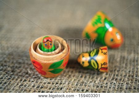 Russian dolls. Matryoshka on linen fabric for the background.