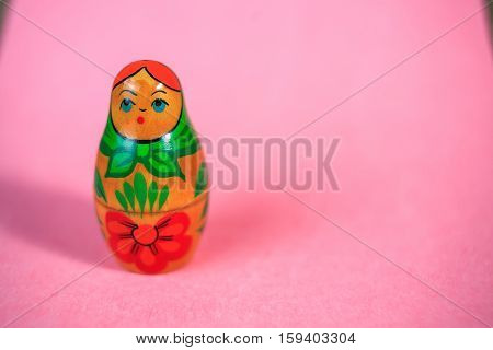 Russian dolls. Matryoshka on pink fabric for the background.