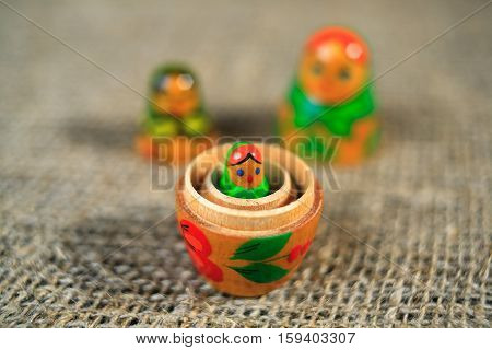 Russian dolls. Matryoshka on linen fabric for the background.