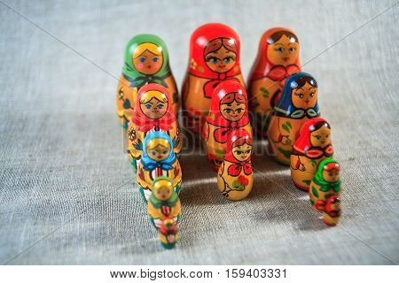 Russian dolls. Matryoshka on linen fabric for the background.