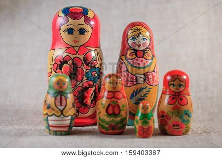 Russian dolls. Matryoshka on linen fabric for the background.