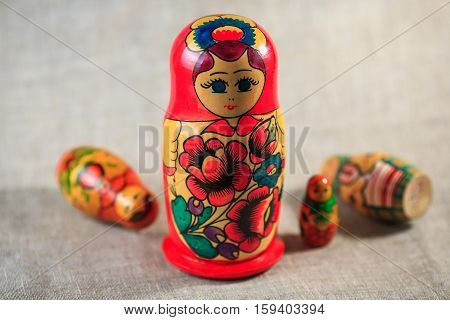 Russian dolls. Matryoshka on linen fabric for the background.