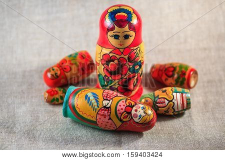 Russian dolls. Matryoshka on linen fabric for the background.