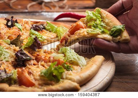 Caesar Pizza On Messy Wooden Background.