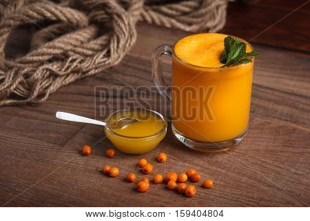 Buckthorn Juice In A Glass With Honey