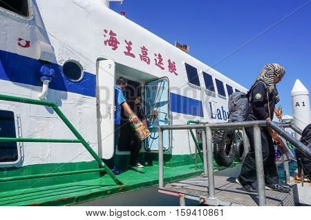 Kota Kinabalu,Sabah-Nov 28,2016:Passengers express ferry arrived from Labuan island in Jesselton terminal,Kota Kinabalu,Sabah.Its a main tourist attraction & cheaper transportation to Labuan Island.