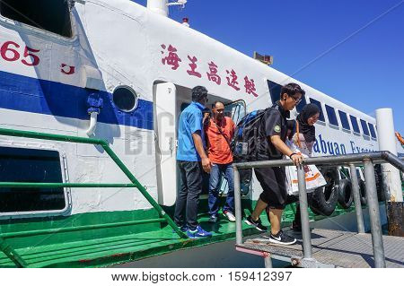 Kota Kinabalu,Sabah-Nov 28,2016:Passengers express ferry arrived from Labuan island in Jesselton terminal,Kota Kinabalu,Sabah.Its a main tourist attraction & cheaper transportation to Labuan Island.