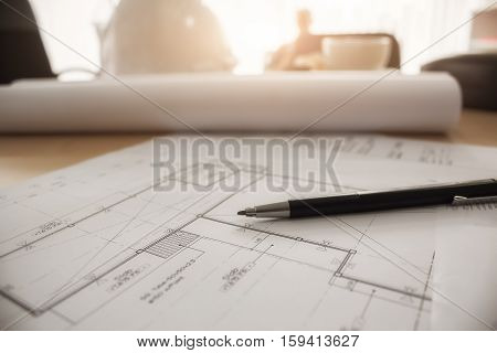 Desk of Engineering project in construction site or office with mining light.Construction concept.Engineering tools.Vintage tone retro filter effectsoft focus(selective focus)