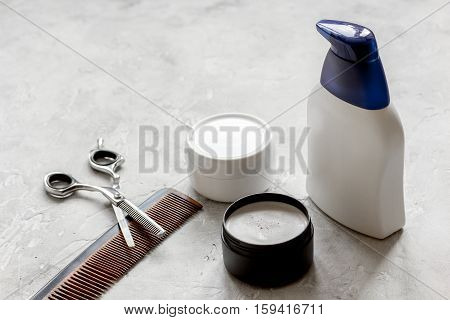 mens cosmetics for hair in bottle at bathroom close up