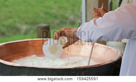 Cheesemaker Pour Rennet Into The Great Copper Cauldron To Make C