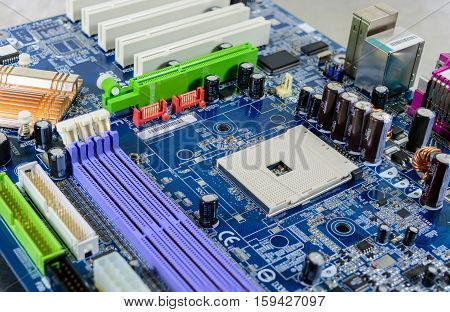 Computer motherboard with electronic component detail background.