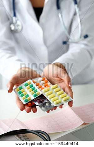 Female Doctor Hand Holding Pack Of Different Tablet Blisters