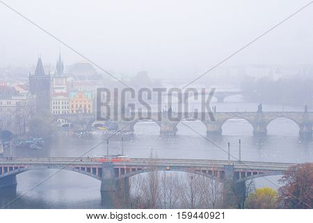 Panorama of an old Prague, bridges and embankment of Vitava river, Czechia