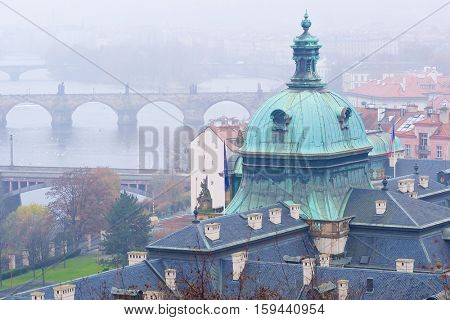 Panorama of an old Prague, bridges and embankment of Vitava river, Czechia