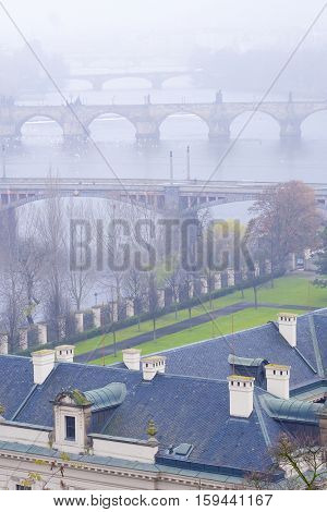 Panorama of an old Prague, bridges and embankment of Vitava river, Czechia
