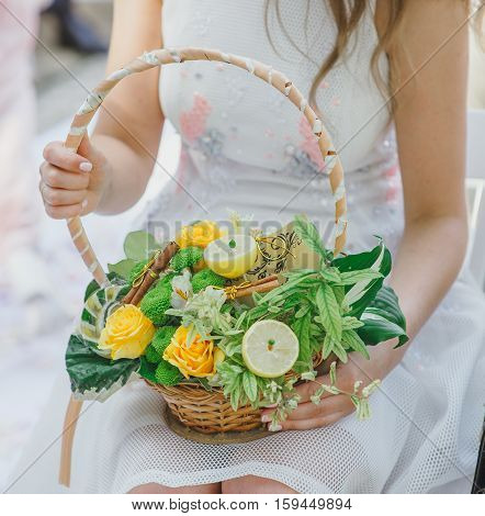 Flower girl at a wedding holding a basket of flowers