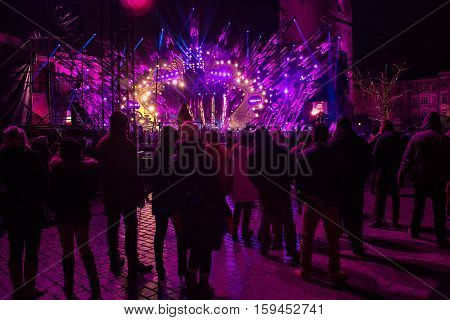 POLAND KRAKOW - JANUARY 01 2015: Celebrating the New Year 2015. People watch the festive show on the Main Market Square in historical center of Krakow.