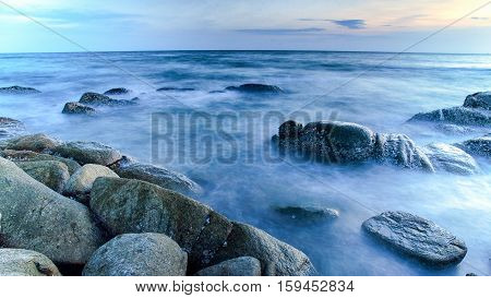 Landscape rock in the ocean long exposure