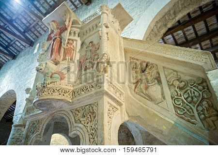 Moscufo, Italy - Septmber 9,  2006:  The polychrome pulpit of Santa Maria del Lago abbey (XII century)