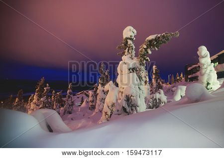 Beautiful cold mountain view of ski resort, winter day with slope, piste and ski lift, evening twilight night picture