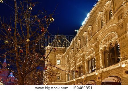 Moscow winter street scene and christmas decoration. Historical centre of the city at night Red square and famous Main Universal Store GUM Trading House