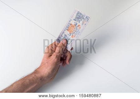 Man Holding One Bhutanese Ngultrum Banknote In His Hand
