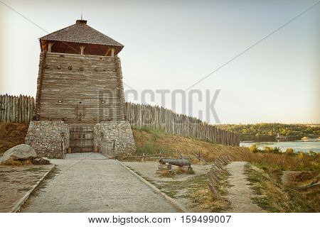 Zaporizhzhya Sich on the banks of the Dnieper. The entry tower. Images on vintage processing.