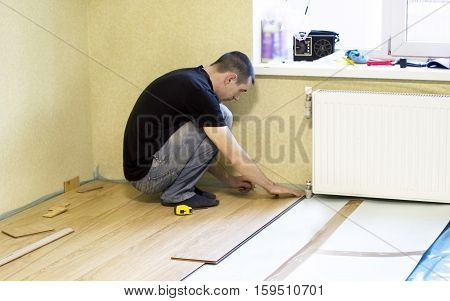 The Process Of Installing Laminate Wooden On The Floor