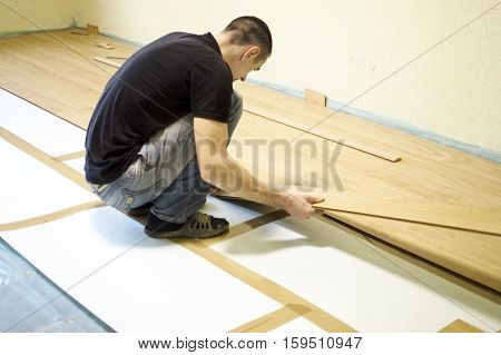 The Process Of Installing Laminate Wooden On The Floor