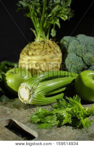 Green vegetables and fruits - celery apples celery root celeriac broccoli healthy diet concept
