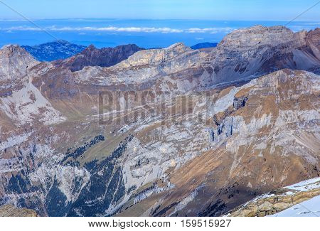 View from Mt. Titlis in the Swiss Alps with Mt. Rigi visible in the background. Mount Titlis is a mountain, located on the border between the Swiss Cantons of Obwalden and Bern.