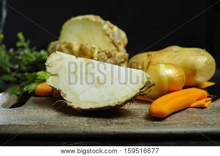 Ingredients for celeriac soup - celery root - celeriac carrots onion potatoes - healthy diet concept
