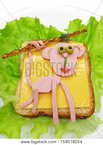 creative sandwich with cheese and salame monkey shape